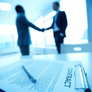 Businessman interacts with a futuristic digital interface.