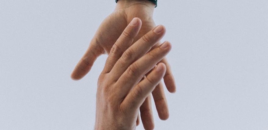 Helping hand reaching out to a new sales manager to teach success