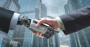 Businessperson and AI robot handshake in front of office buildings