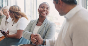 Handshake, networking, partnership, relaxing or happy employees shaking hands, meeting.