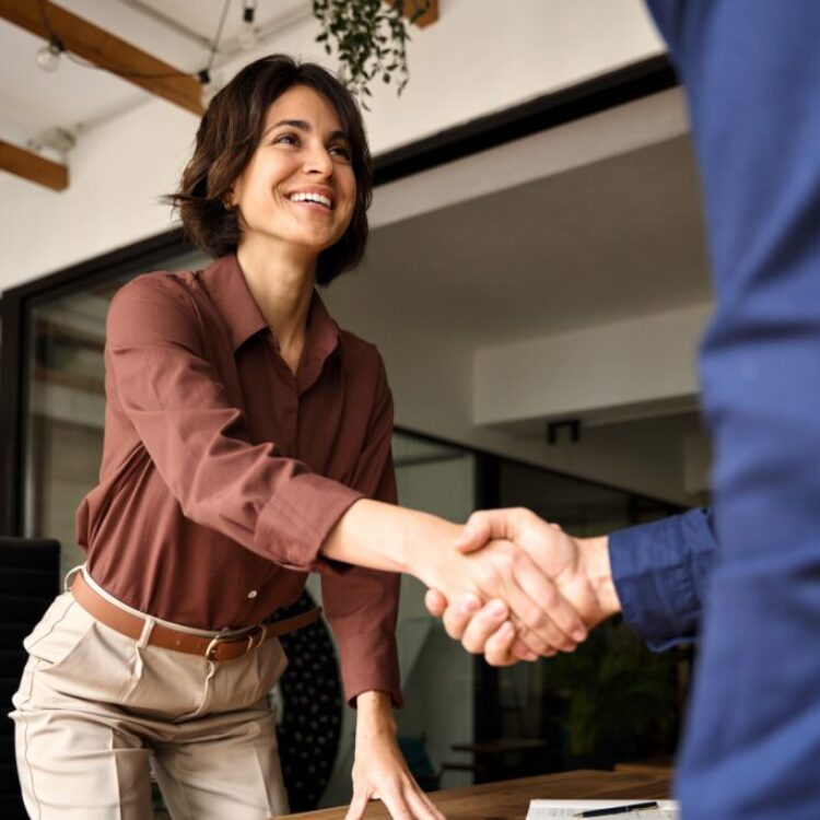 Handshake,Of,Happy,Young,Business,Woman,And,Business,Man,At