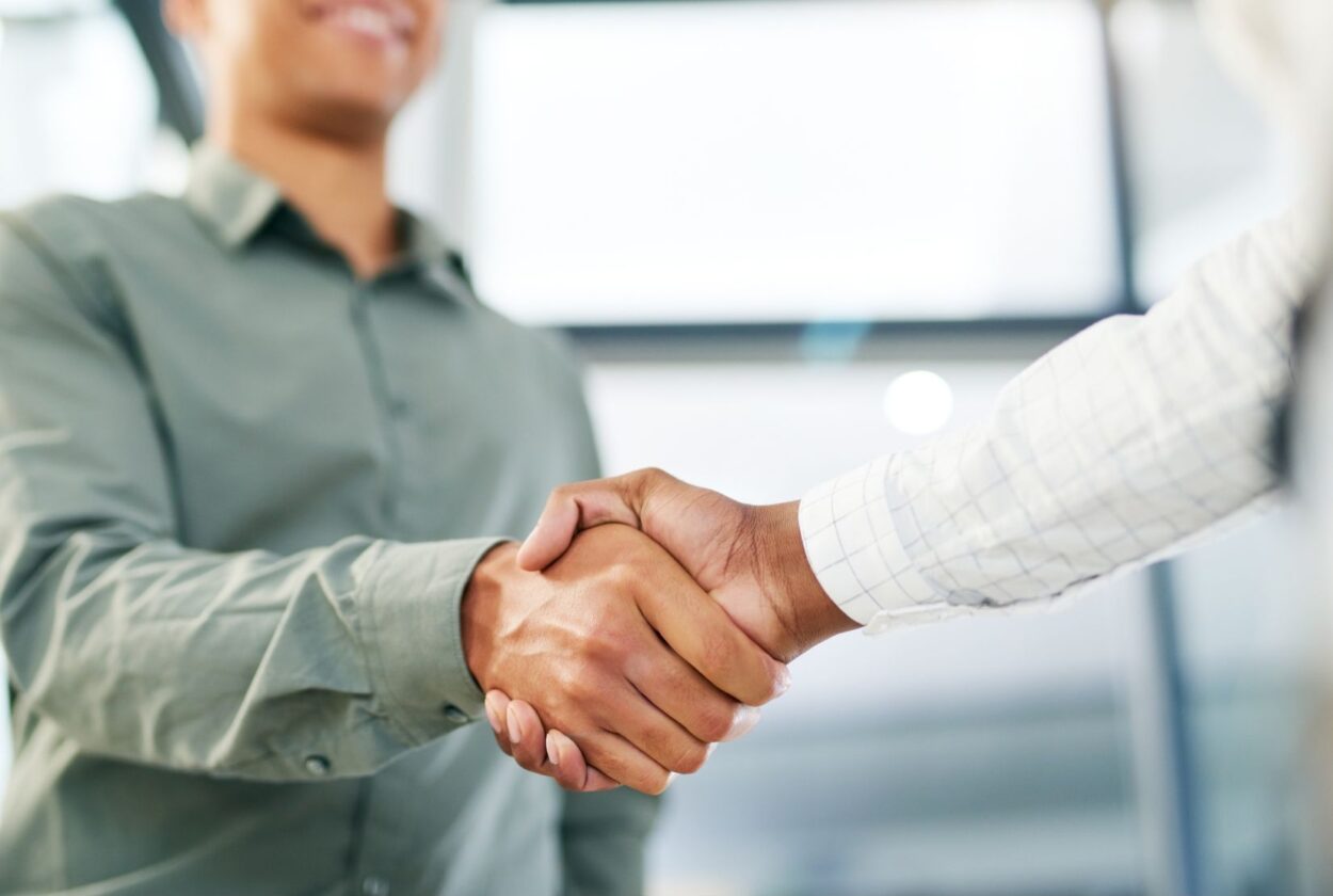 Leader and employee shaking hands