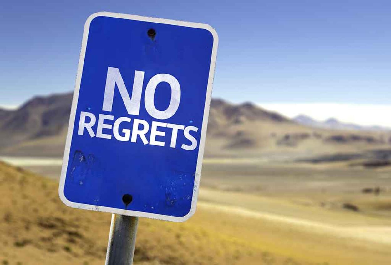 No Regrets Sign with a Desert Background